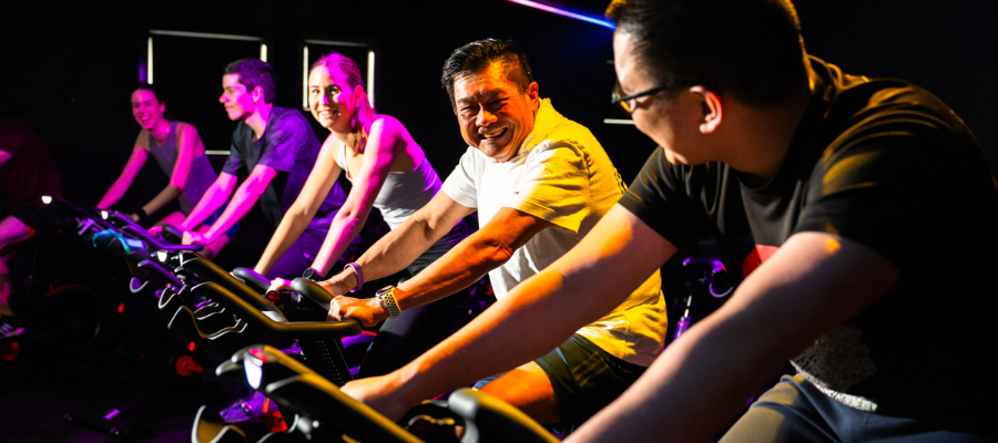 five people on spin bikes