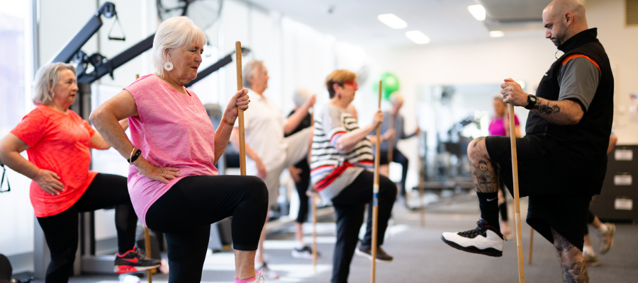 Move for Life class with older adults and an instructor doing an exercise all together