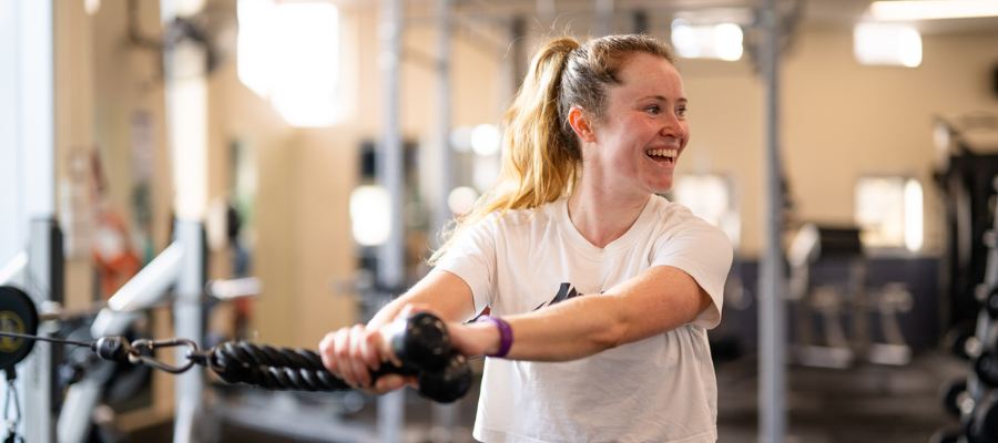 Woman in gym smiling