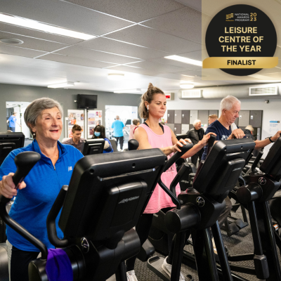 Two women and a man working out on elliptical machines at Collingwood Leisure Centre