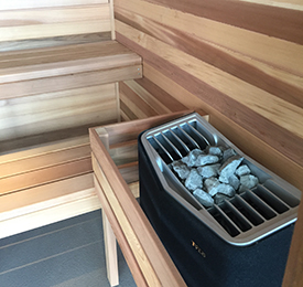 Heater and stones in new sauna