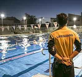 Fitzroy Swimming Pool lifeguard watching over 50m pool at night