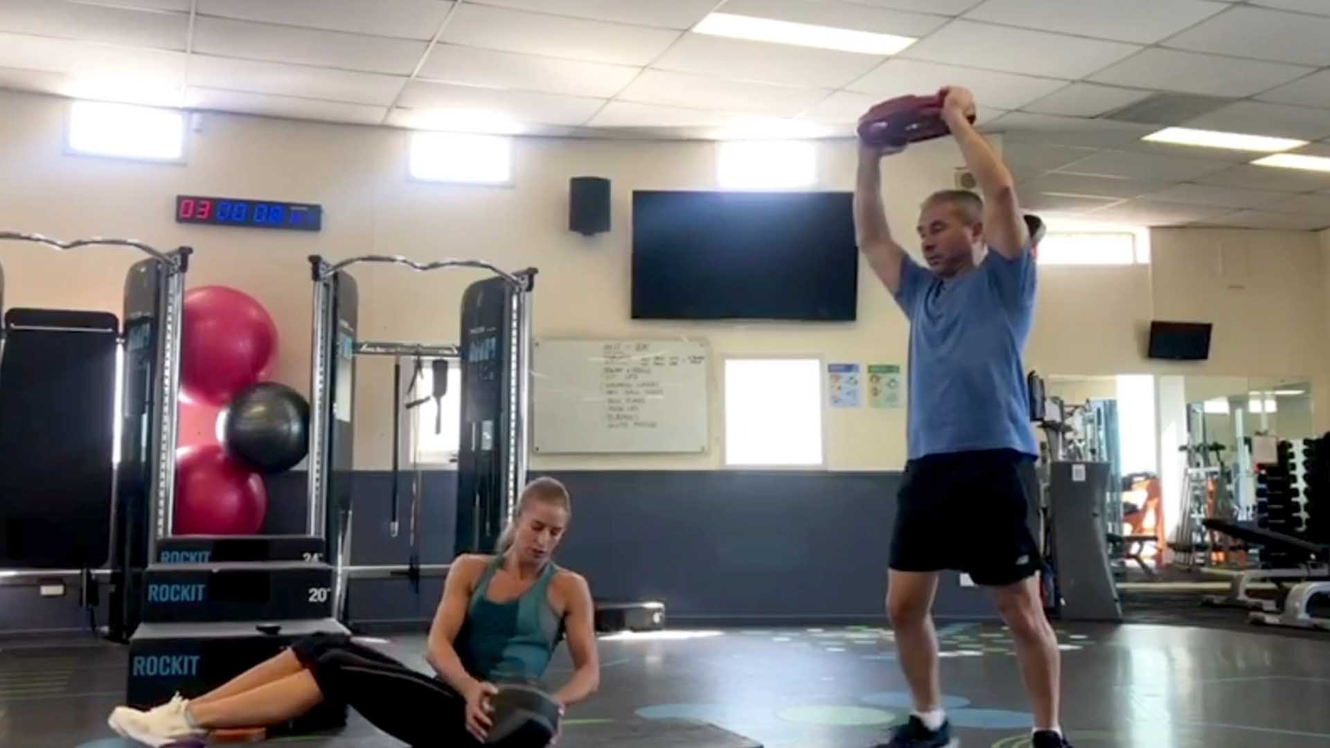 Joe and Lauren leading a workout