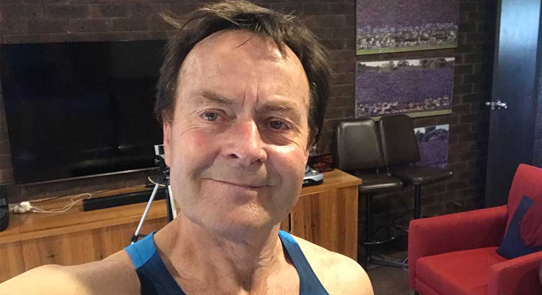 Gym Instructor Bill taking a selfie and smiling in his activewear at home