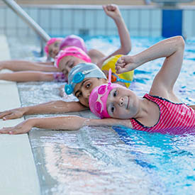 Young children in the pool during swimming lesson